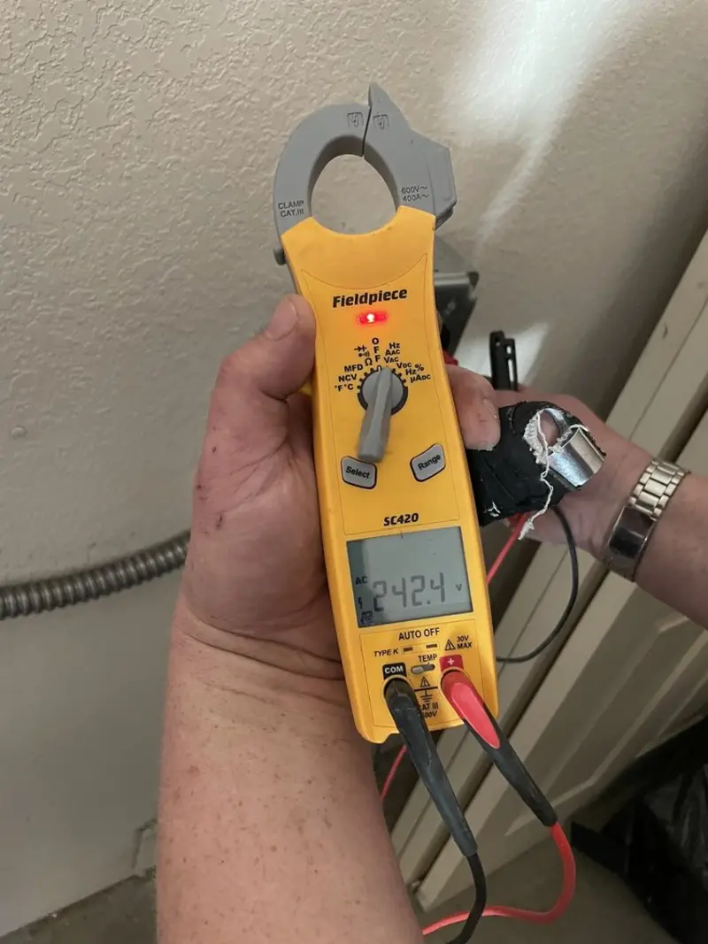 Voltage testing with clamp meter during Ceiling Fan Installation in Guymon